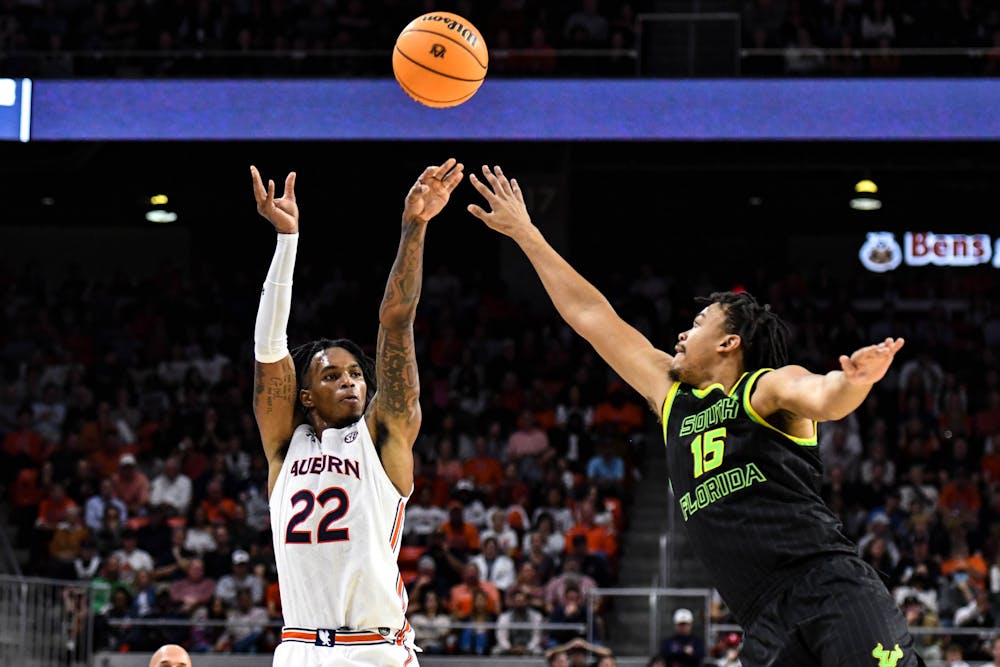 <p>Auburn forward Allen Flanigan (22) shoots a three-point shot in the first half against the University of South Florida in Neville Arena on Nov. 11, 2022.</p>