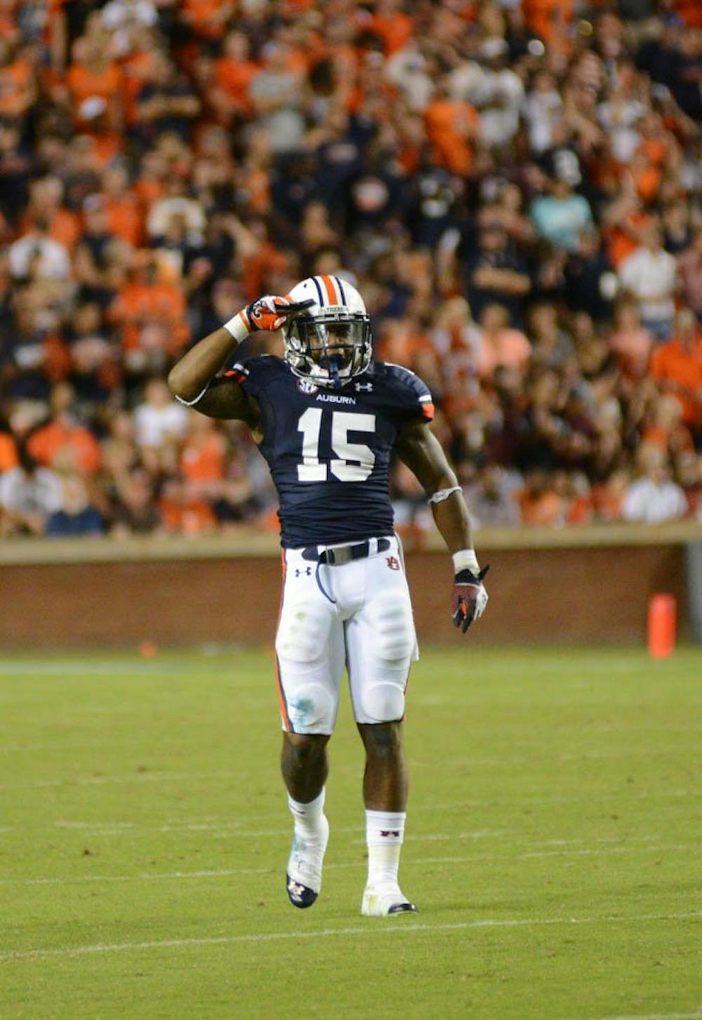 <p>After completing a sack, Joshua Holsey salutes the crowd.  (Daniel Oramas / MULTIMEDIA EDITOR)</p>