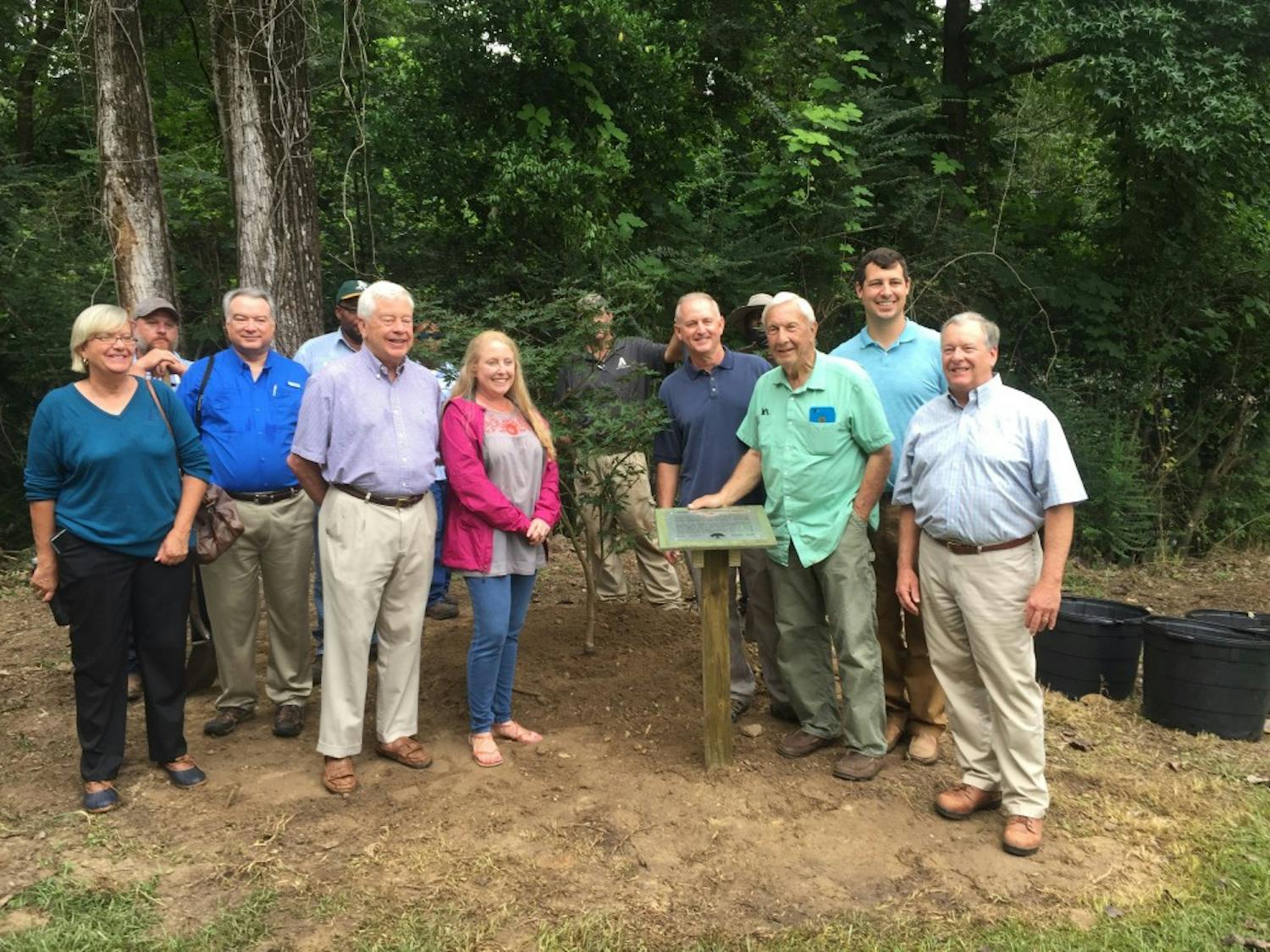 Former Auburn Head Coach Pat Dye in front of his donated Japanese maple to the George Bengston Historic Tree Trail with members of the Auburn Tree Commission and City employees on Aug. 8, 2017 in Auburn, Ala.