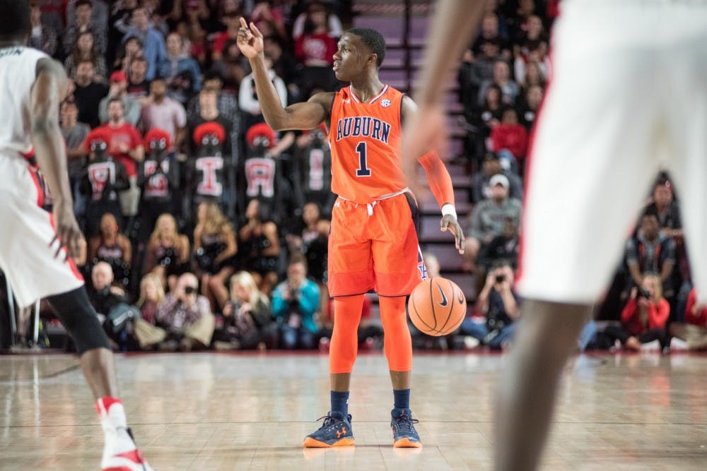 Jared Harper (1) directs the Auburn offense&nbsp;during Auburn Basketball vs. Georgia on Saturday, Feb. 10, 2018, at Stegeman Coliseum in Athens, Ga.