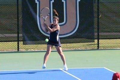 Junior Plamena Kurteva returns a serve from Alabama Saturday afternoon in women's doubles. The Tigers lost out to the Crimson Tide, 4-3. (Rebecca Croomes / PHOTO EDITOR)