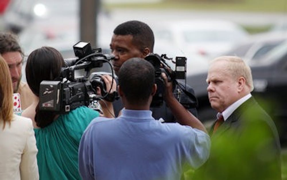 Harvey Updyke Jr., leaves the Opelika courthouse Wednesday after waiving his preliminary hearing. (Emily Adams / Photo Editor)