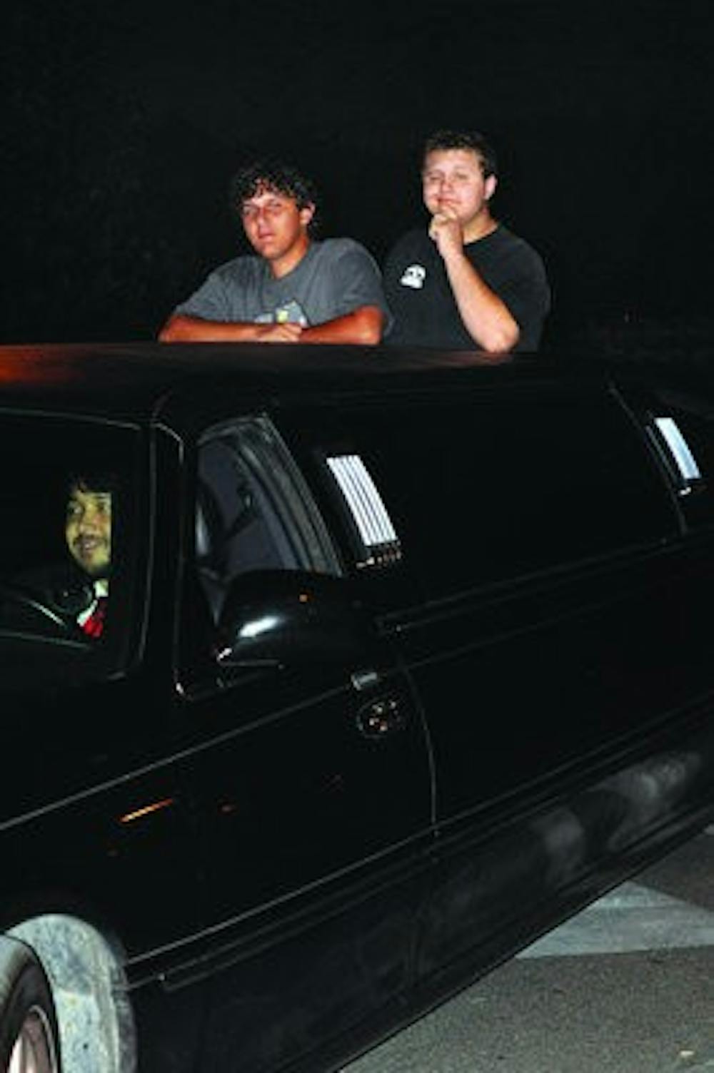 Ben Furman and David Raley ride a limousine from Terrell Hall to the Tiger Zone area of Village Dining. Tiger Dining is sponsoring the rides every Monday in October. (PHOTO ILLUSTRATION)