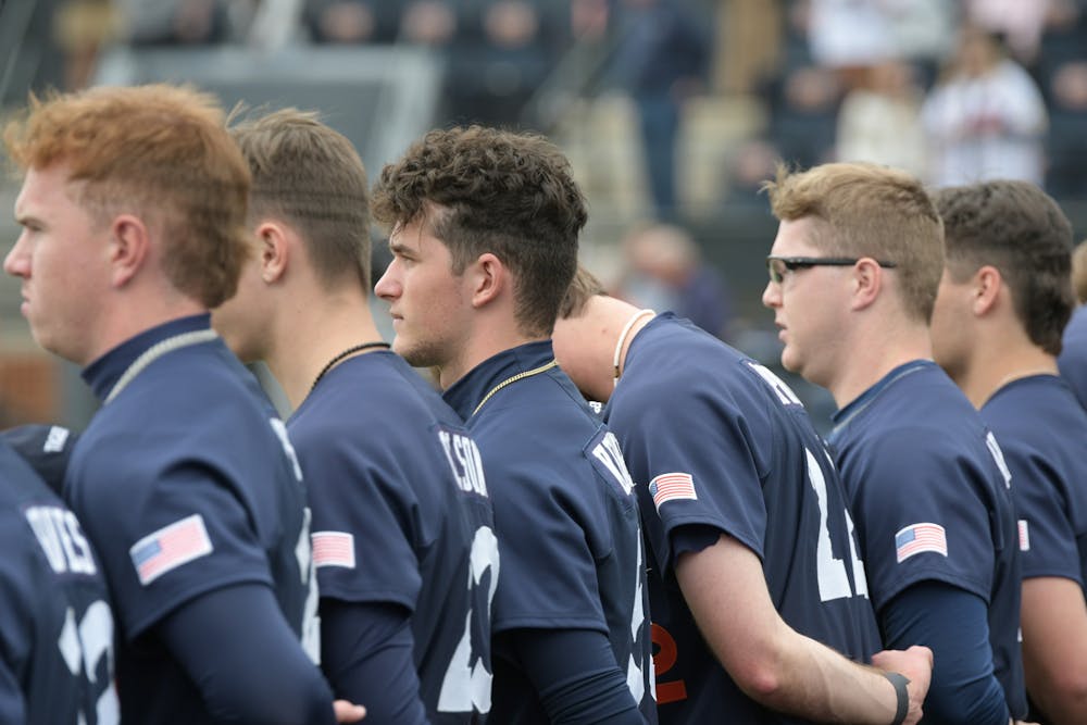 <p>Auburn Baseball with hand over hearts during the playing of the national anthem against UConn on March 2nd 2024</p>