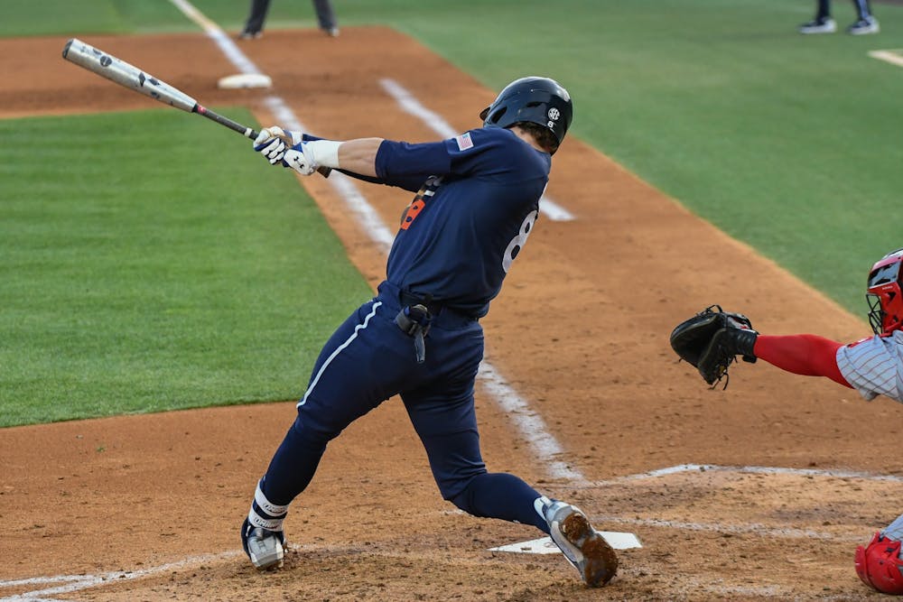 Auburn third baseman Bryson Ware (8) swings for the ball during the home opener against Indiana in Plainsman Park on Feb. 17, 2023.