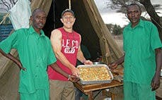 While in Kenya, Tyler Viars (right) worked with the locals and cooked meals with them.
