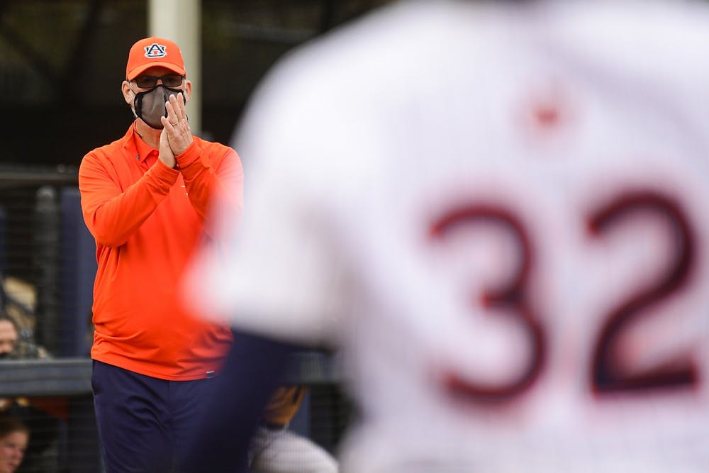 Mar 21, 2021; Auburn, AL, USA; Auburn Tigers softball head coach Mickey Dean reacts while Makenna Dowell (32) is at bat during the game between Auburn and Kennesaw State at Jane B. Moore Field. Mandatory Credit: Shanna Lockwood/AU Athletics