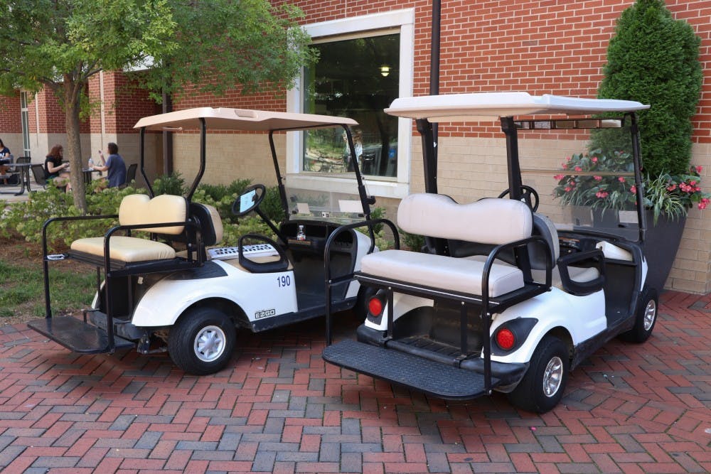 Auburn Universities campus golf carts parked in between the Student Center and Haley Center on Sep. 3, 2019, in Auburn, Ala.