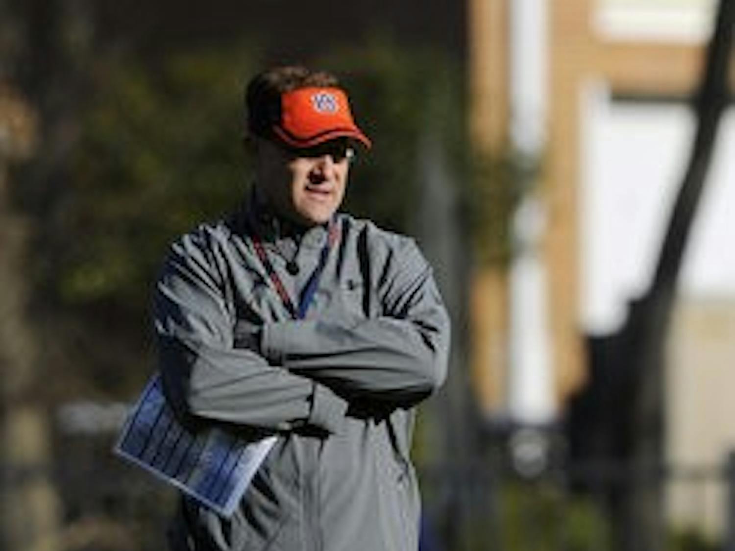 Gus Malzahn watches as his Tigers take the field for the first practice under the new head coach. (COURTESY OF TODD VAN EMST)