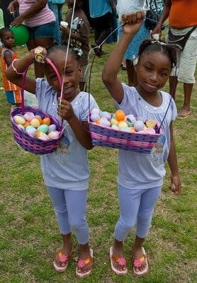 Amaya and Alissa Ware, 6 and 7, of Auburn show off their Easter eggs at Kiesel Park. (FILE PHOTO)