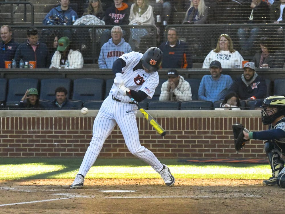 Cade Belyeu (14) mid swing during the Auburn vs Georgia Tech game Tuesday, March 17, 2026.