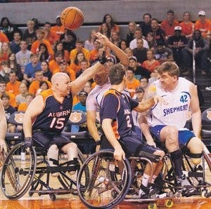 Auburn's wheelchair basketball team scrimmages against a team from the Shepherd Center during halftime of the Jan. 21 men's basketball home matchup against the University of South Carolina. (Courtesy of Jimmy Rhyne)