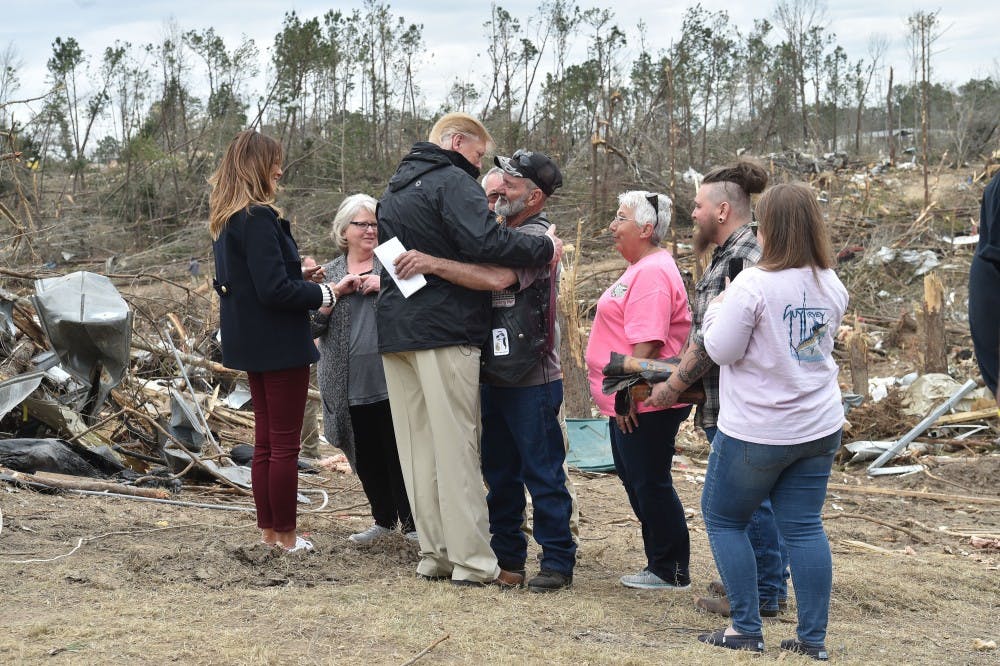 U.S. President Donald Trump greets residents during a tour of tornado-affected areas on March 8, 2019 in Beauregard, Ala. (Nicholas Kamm/AFP/Getty Images/TNS) 