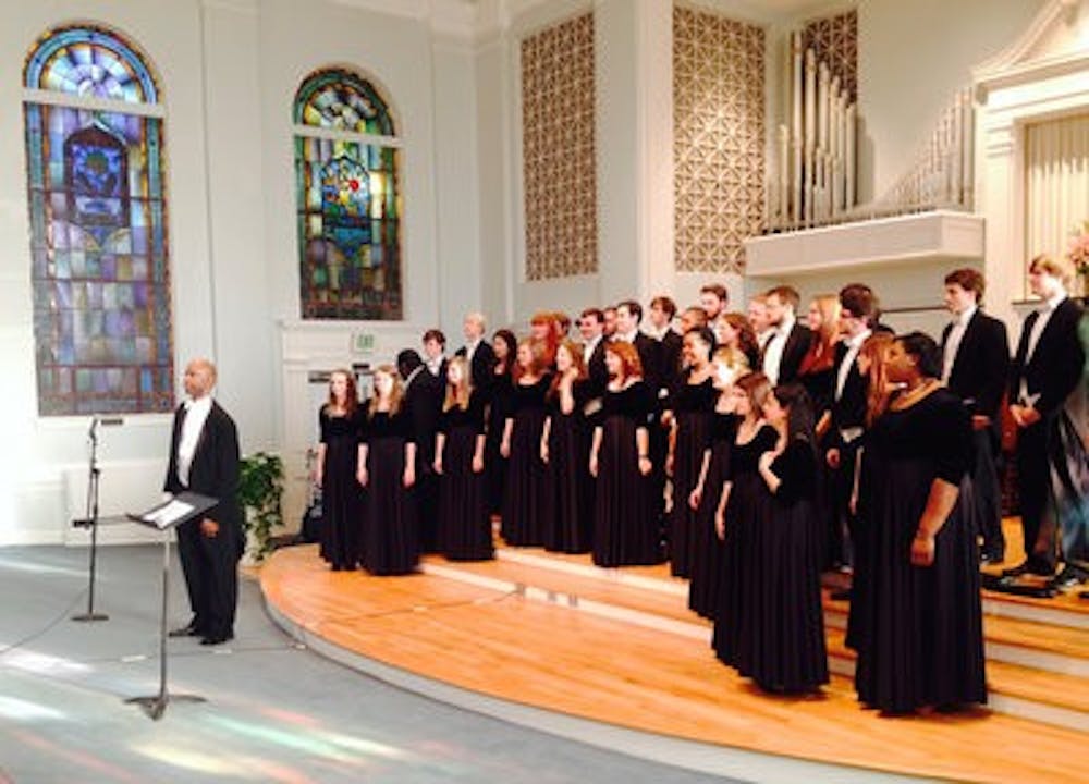 William Powell conducts the Auburn University Chamber Choir at Auburn First Baptist Church (Derek Herscovici / Campus Reporter)