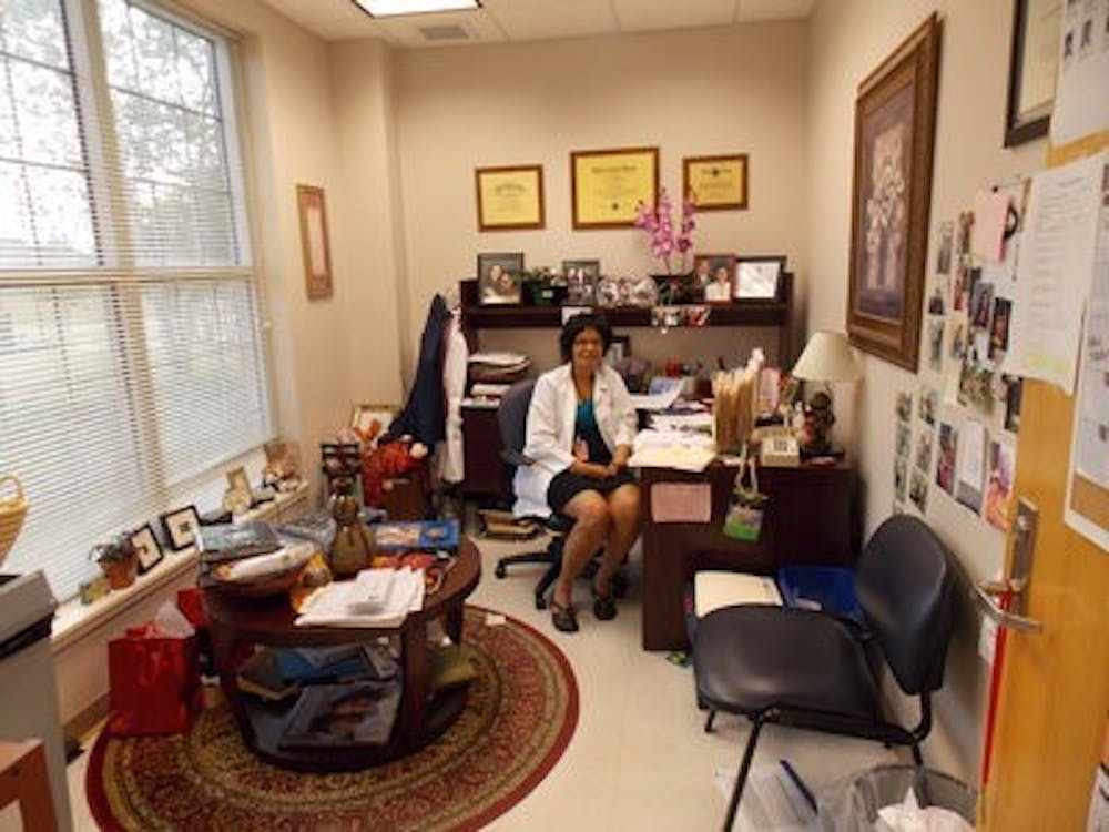 Graham-Hooker decorates her office with chairs and rugs to make the room feel more like home.