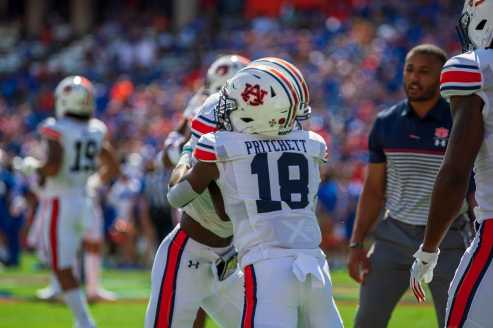 <p>Nehemiah Pritchett (18) warms up with some drills prior to Auburn vs. Florida, on Saturday, Oct. 5, 2019, in Gainesville, Fla.</p>