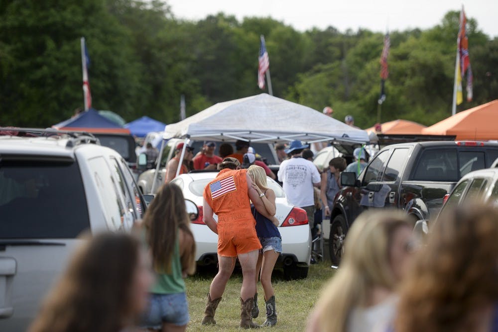 Two Rodeo attendees dance to music at the event in the tailgate area. (Contributed by Zach Bland) 