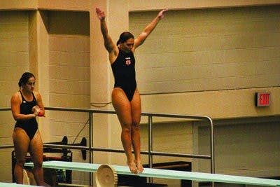 Senior diver Anna Aguero prepares to execute her diving routine. (Alex Sager / ASSOCIATE PHOTO EDITOR)
