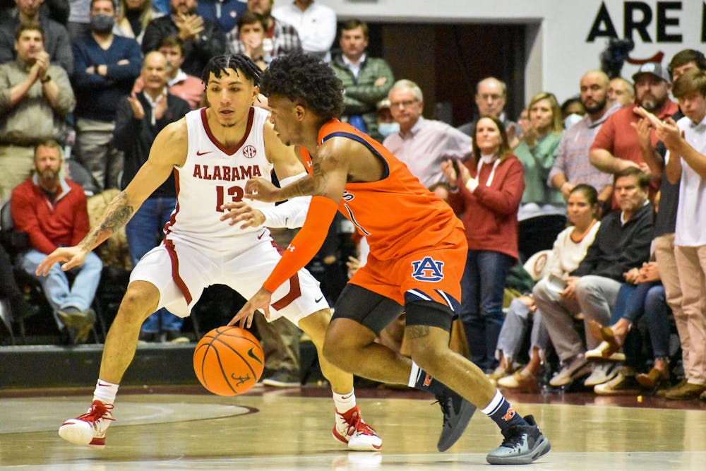 January 11, 2022; Tuscaloosa, Alabama; Wendell Green Jr. (1) drives on an Alabama defender in the Iron Bowl of basketball between Auburn and Alabama.