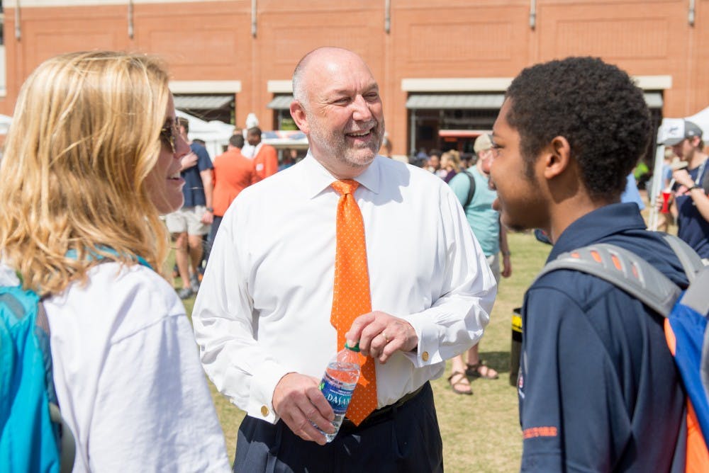 <p>Dr. Steven Leath greets students&nbsp;at the student celebration for his installation, on the Student Center Greenspace in Auburn, Ala. on Wednesday, March 28, 2018.</p>