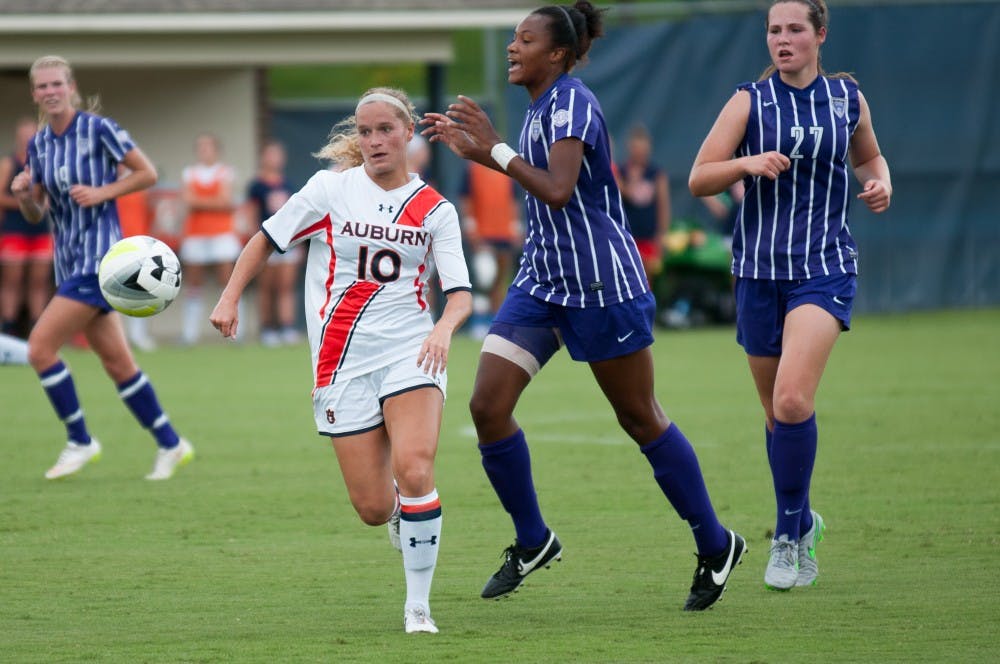 <p>Ashton Brock (10) sprints towards the ball during the Tigers match against Furman University at the Auburn Soccer Complex on Sunday, Aug. 30.</p>