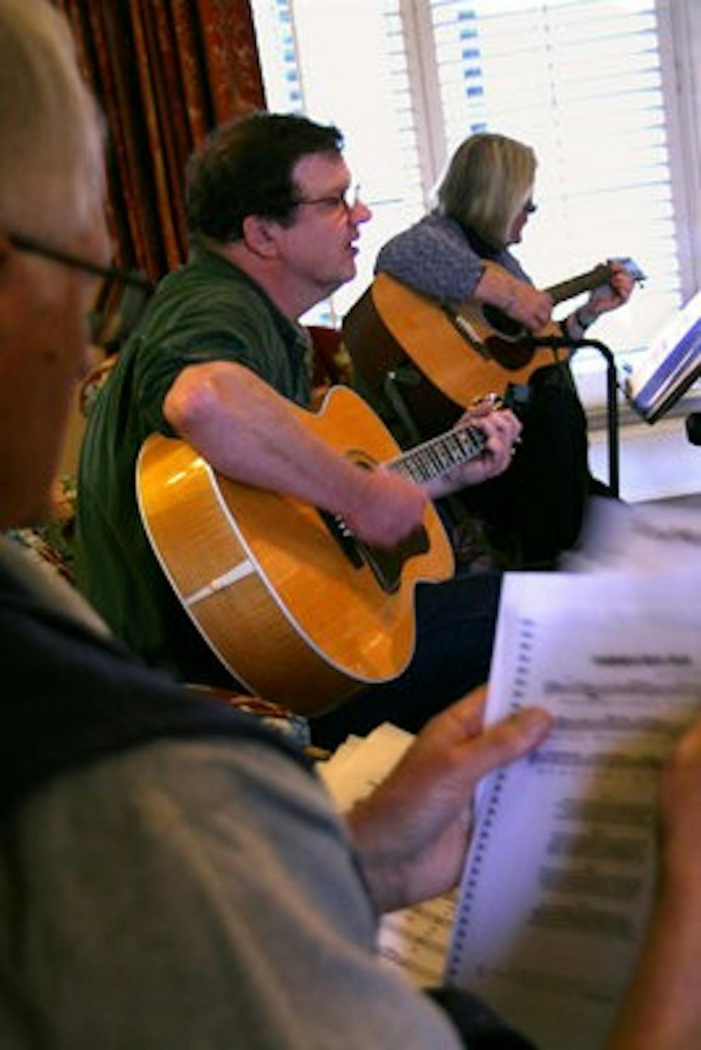 Tom O'Shea, instructor of English, and Betty Louise Whitford, dean of the College of Education, practice together. (Rebekah Weaver / Assistant Photo Editor)