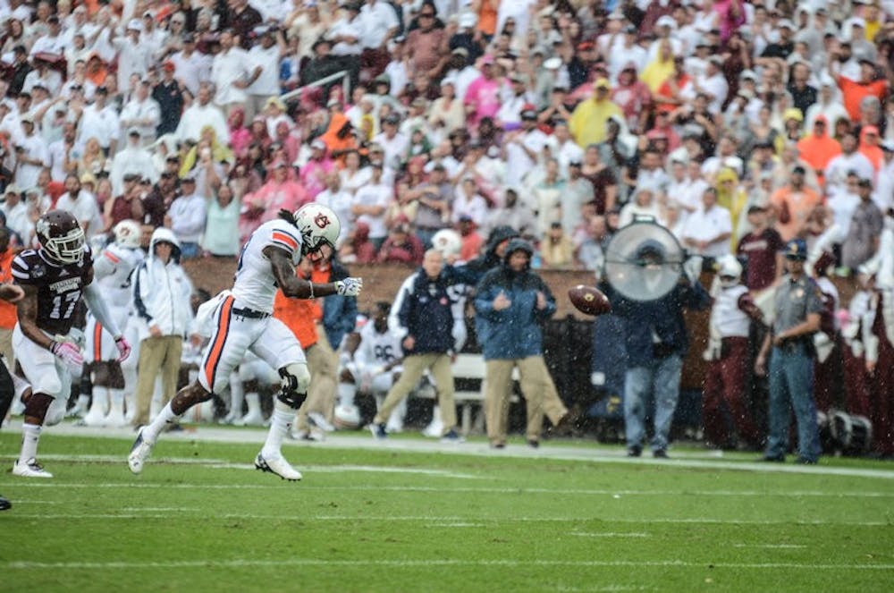 Sammie Coates misses a pass in the rain against Mississippi State on October 11.

Raye May / PHOTO EDITOR