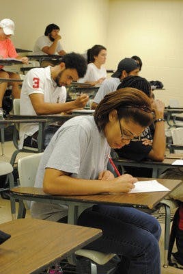 Crystal Johnson, senior in biomedical sciences and prepharmacy, takes notes during Intro to Africana Studies, a class that looks into the development of the Africa we know today. (Maria Iampietro / Associate Photo Editor)