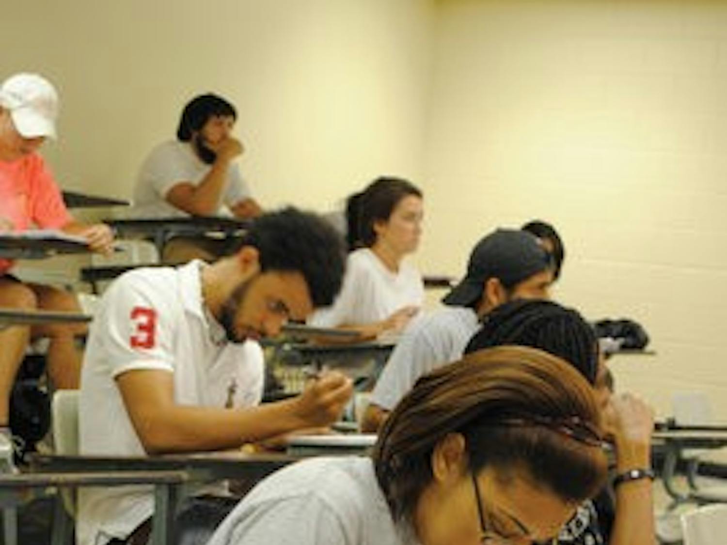 Crystal Johnson, senior in biomedical sciences and prepharmacy, takes notes during Intro to Africana Studies, a class that looks into the development of the Africa we know today. (Maria Iampietro / Associate Photo Editor)