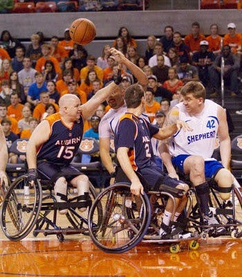 Auburn's wheelchair basketball team scrimmages against a team from the Shepherd Center during halftime of the Jan. 21 men's basketball home matchup against the University of South Carolina. (Courtesy of Jimmy Rhyne)