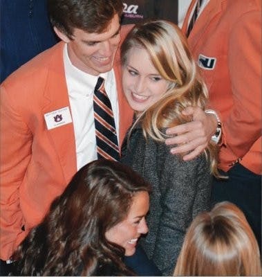 Tara Jones celebrates with Mathew Richter after being announced
Miss Auburn for 2013. (Raye May / PHOTO EDITOR)