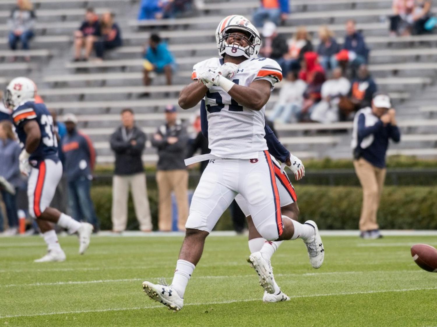 Richard McBryde (51) reacts after breaking up a play during Auburn's A-Day game on Saturday, April 7, 2018, in Auburn, Ala.