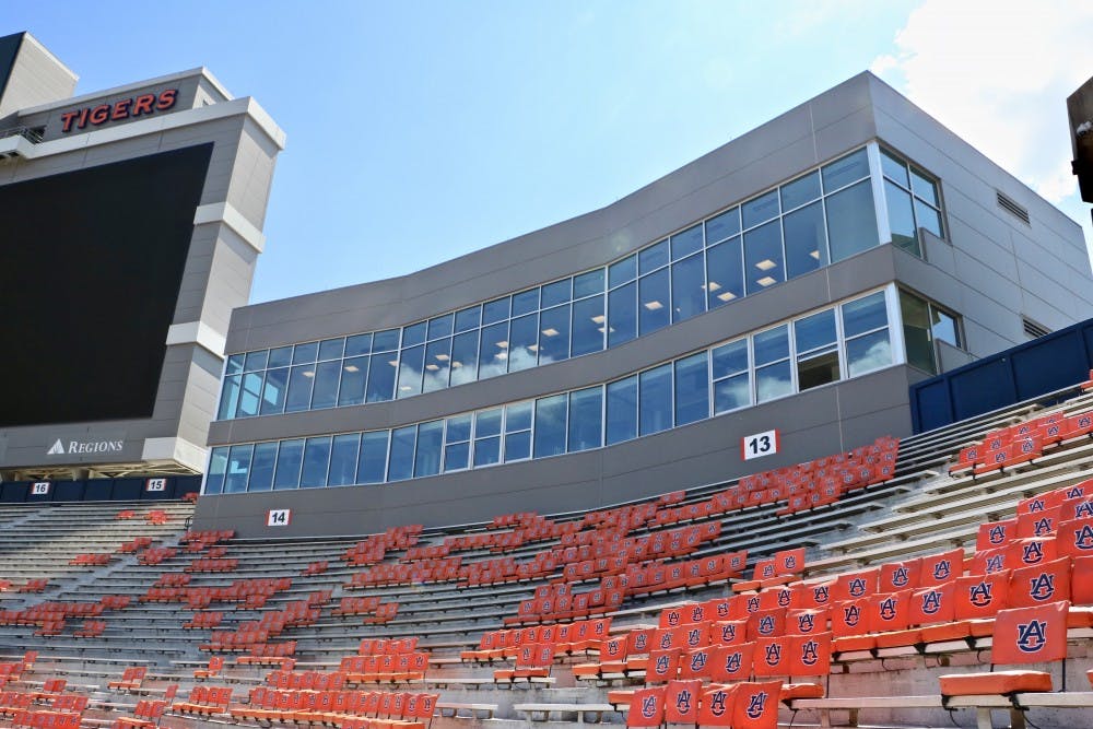 The open window in the bottom right corner of the press box homes the memory and reserved seat of the Voice of the Auburn Tigers in Jordan Hare Stadium on Sept. 2019, in Auburn, Ala. 