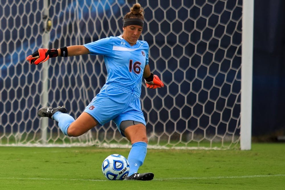 Alyse Scott (#16) kicking the ball downfield. (Kenny Moss | Photographer)