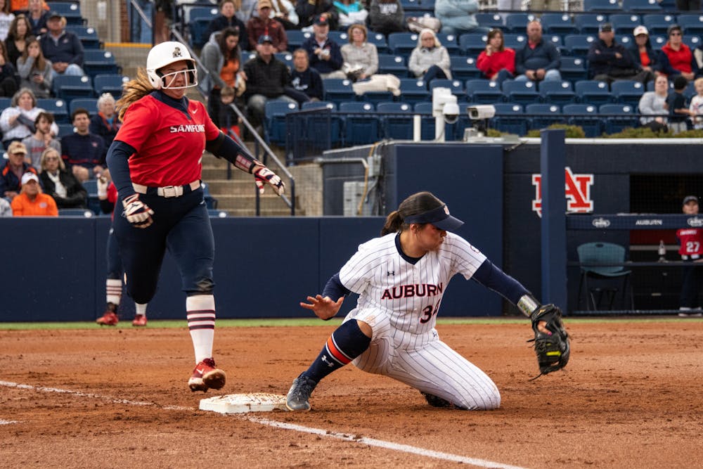 <p>Amelia Lech (34) striking out a batter seconds before she could make it to first base during the Auburn Tigers' softball match against the Samford Bulldogs on April third, 2024.</p>