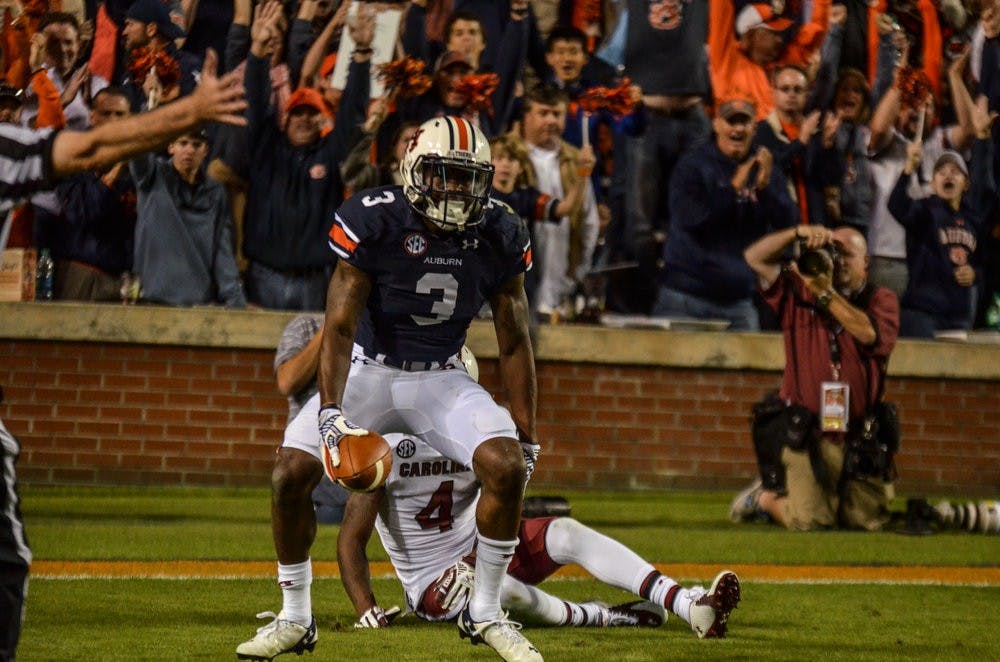 Jonathan Jones celebrates after intercepting the ball in the end zone against South Carolina. Jones is now a candidate for both the Thorpe Award and the Nagurski Trophy.Raye May / PHOTO EDITOR