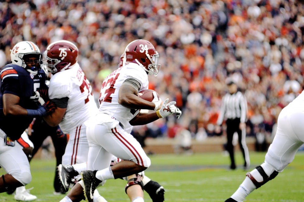 Damien Harris (34) runs the ball during Auburn Football vs. Alabama on Saturday, Nov. 25, 2017 in Auburn, Ala.