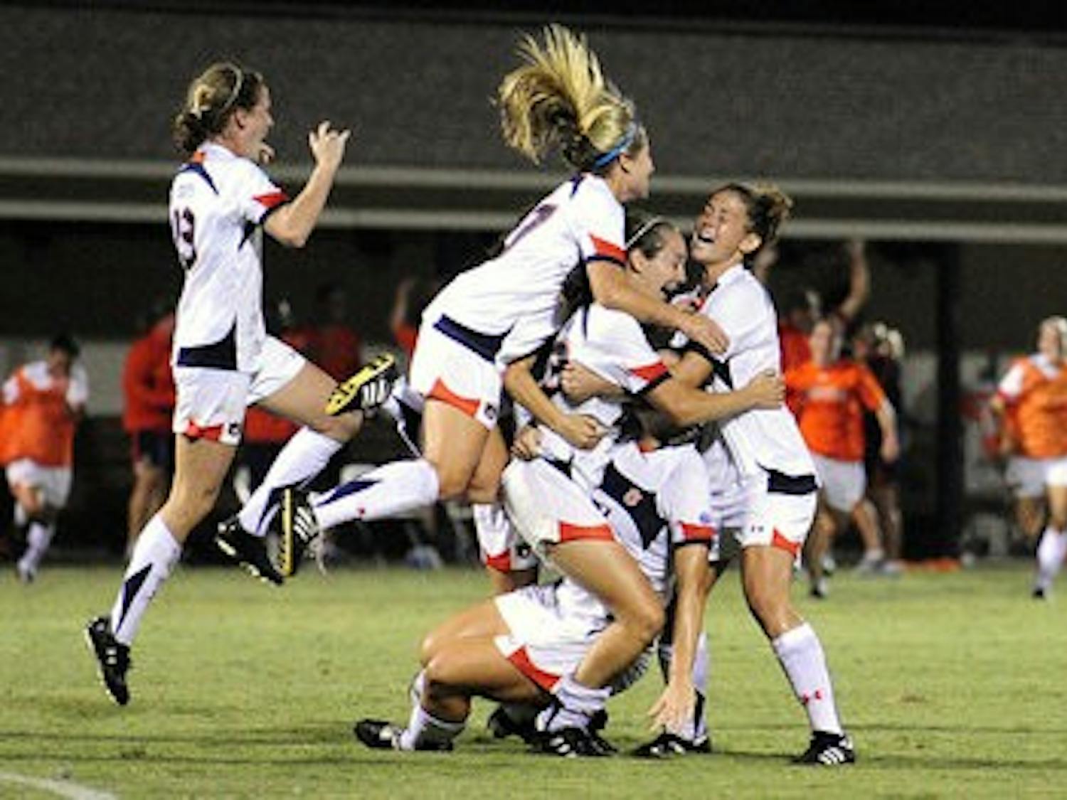 Katy Frierson celebrates with her teammates after scoring the winning goal in overtime against FSU earlier this season. (Todd Van Emst / Media Relations)