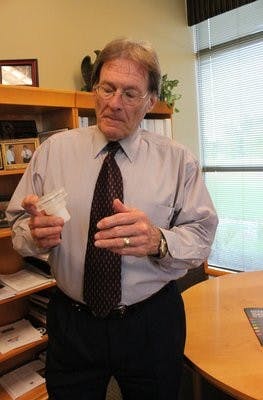 John Weete, assistant vice president for technology transfer,  shows off a newly-patented water filter. (Alex Sager / PHOTO EDITOR)