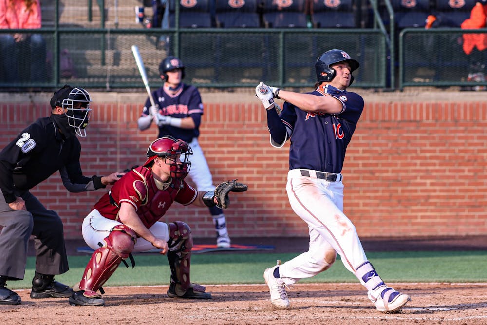 Mar 6, 2021; Auburn, AL, USA; Auburn Tigers infielder/outfielder Tyler Miller (10) watches the ball for a home run during the game between Auburn and Boston College at Auburn Arena. Mandatory Credit: Jacob Taylor/AU Athletics