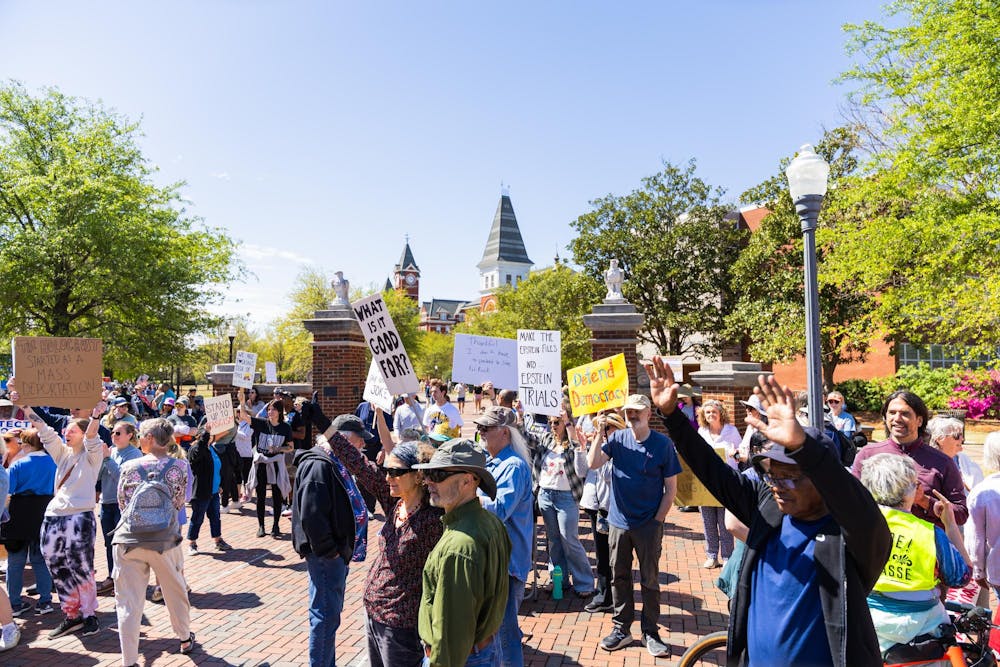 <p>Protesters cheer on Toomer's Corner on March 28, 2026.</p>