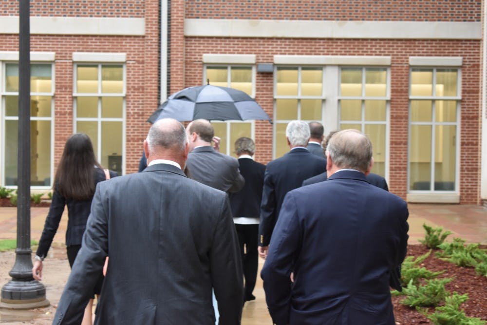 Gov. Kay Ivey is followed by Mayor Bill Ham and Auburn University President Steven Leath while touring the University's new School of Nursing building on July 25, 2017 in Auburn, Ala.