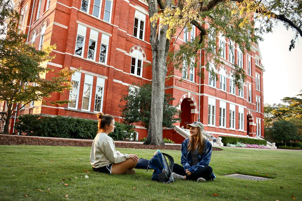 Two students converse on Samford Lawn on Sept. 27, 2022