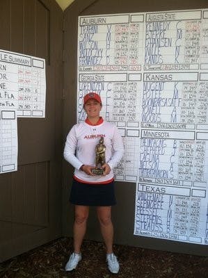Freshman Victoria Trapani poses with her medalist trophy after shooting a 73 to claim first place individually. (CONTRIBUTED)