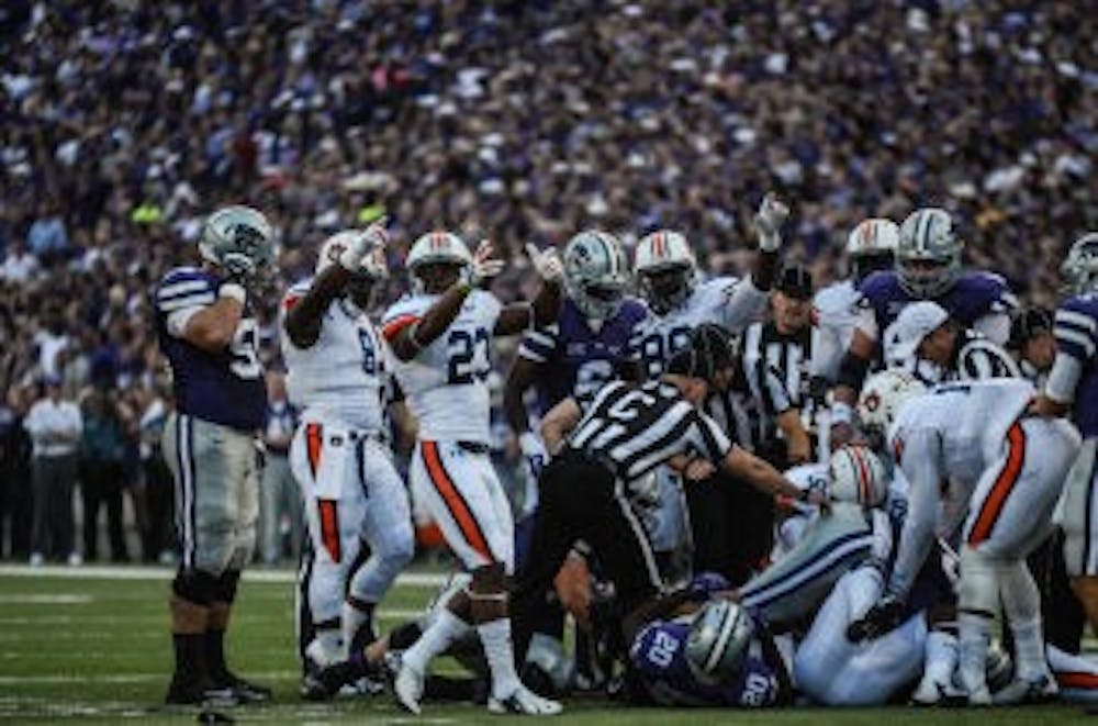 The Auburn defense recovers a fumble in the first half of Thursday night's victory over Kansas State (Raye May / Photo Editor)