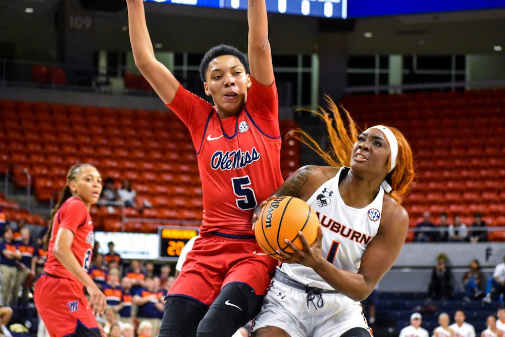 Xaria Wiggins (1) fights through contact in the paint in a match between Auburn and Ole Miss in the Auburn Arena on Feb. 24, 2022.