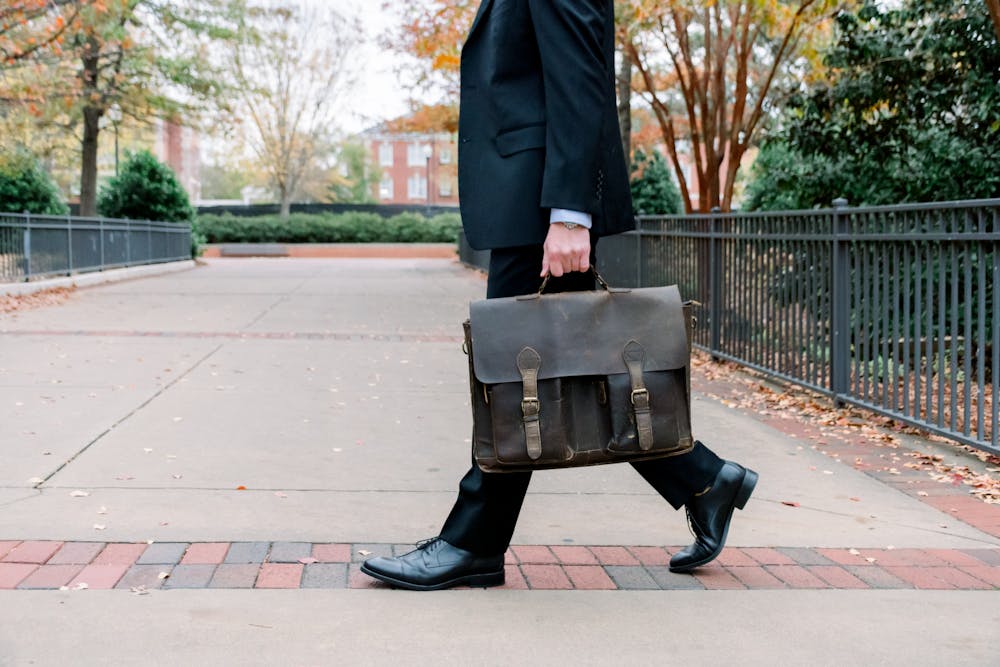 <p>Staged photo of man walking with briefcase.&nbsp;</p>