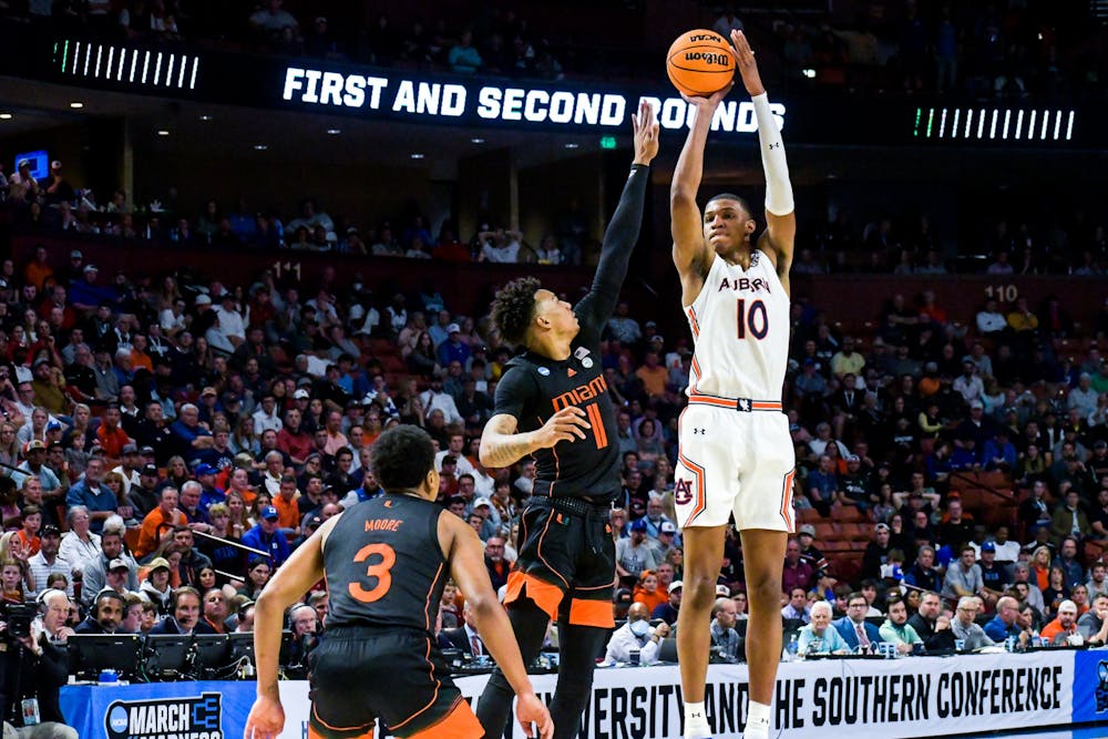 Jabari Smith (10) pulls up from three during a match between Auburn and Miami in the second round of the NCAA Tournament in Greenville, South Carolina, on March 20, 2022.