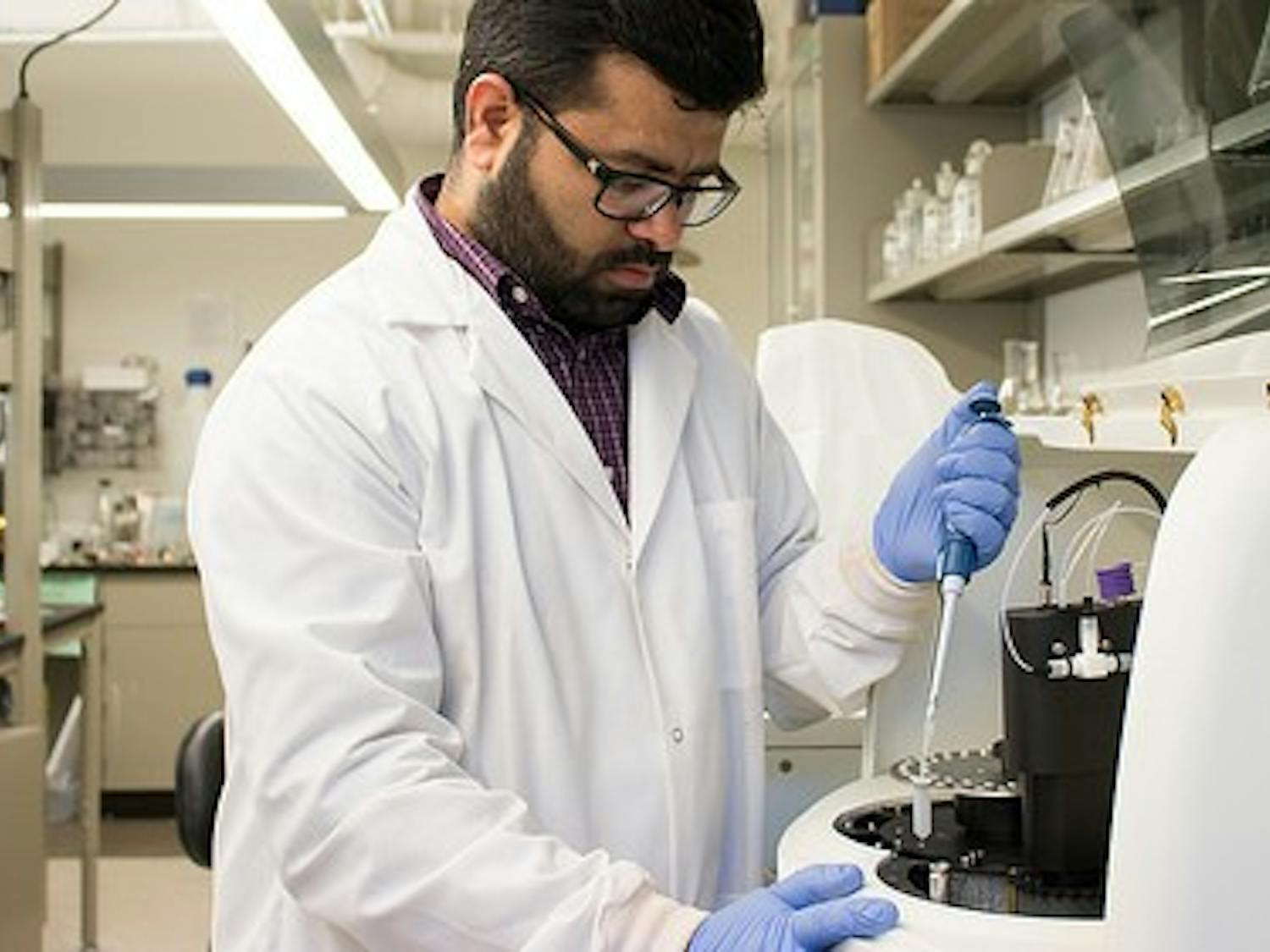 Jasmeet Lamba, assistant professor in the Auburn University College of Agriculture’s Department of Biosystems Engineering, analyzes water samples as part of a three-year study to ensure poultry litter doesn’t become a source of excessive phosphorus in surface waters.