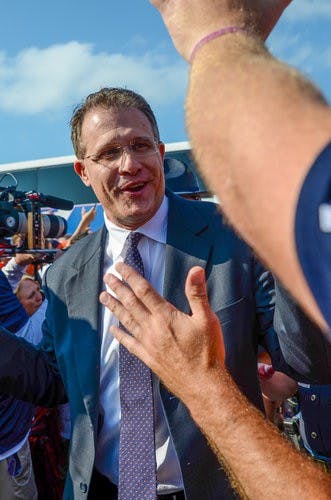 Gus Malzahn high-fives fans at Tiger Walk at Kansas State.

Raye May / PHOTO EDITOR